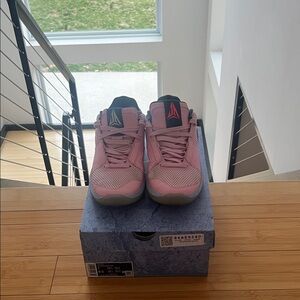 Nike Pink Low-Top Basketball Shoe with Black Swoosh